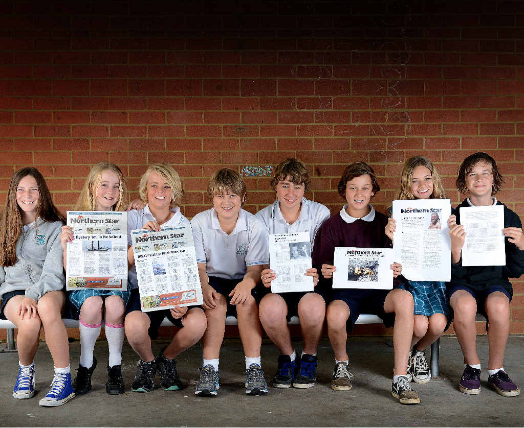 BUDDING EDITORS: Year Seven students from Byron Bay High School proudly display their mock-up newspaper front page history projects. BUDDING EDITORS: Year Seven students from Byron Bay High School proudly display their mock-up newspaper front page history projects.